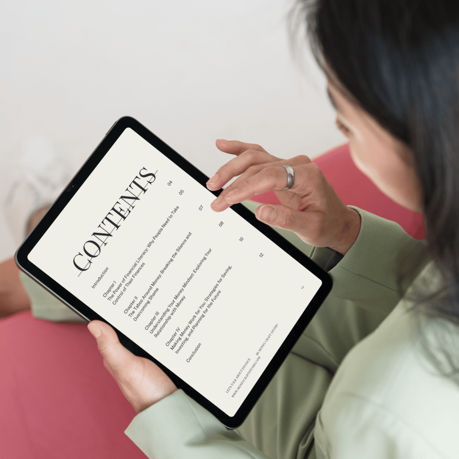 Person in Her Home Reading Tablet